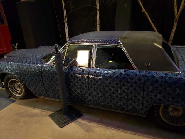 A car, completely covered in tile