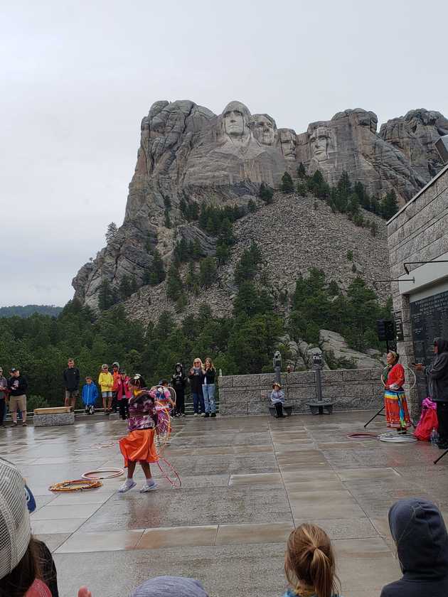 Hoop dancers in front of Mount Rushmore