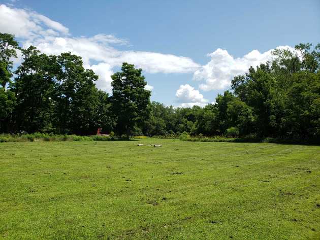 The Ethan Allen Homestead. His house is the red building hiding in the trees